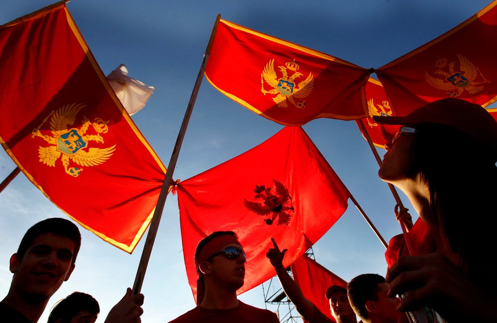Montenegran 'YES' supporters (pro independence) gather on Thursday evening, in Podgorica, for a rally prior to Sundays referendum about whether Montenegro should part from Serbia. The red flag is the old flag of Montenegro. Picture by Peter Nicholls-The Times-19/05/06