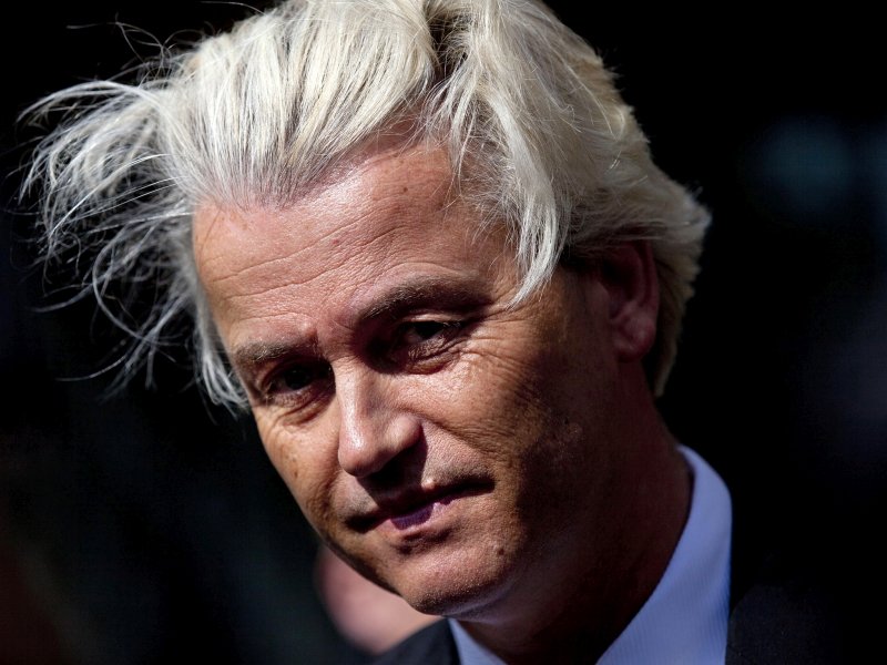 FILE - In this May 12, 2014 file photo Dutch lawmaker Geert Wilders pauses, as he speaks to journalists outside the Dutch National Bank in Amsterdam. A Dutch court said Friday Dec. 9, 2016 that populist anti-Islam lawmaker Geert Wilders is guilty of hate speech charges. (AP Photo/Peter Dejong, File)